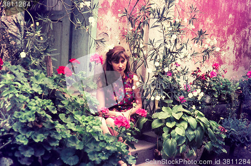 Image of Original vintage colour slide from 1960s, young woman sitting in