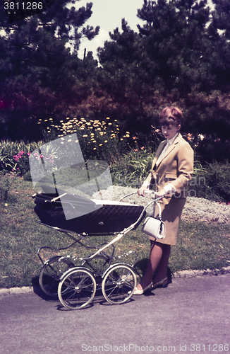 Image of Original vintage  colour slide from 1960s, young woman walking h