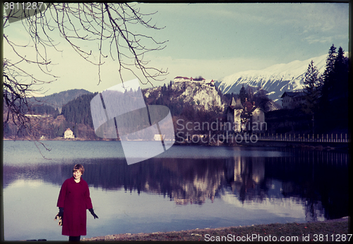 Image of Original vintage colour slide from 1960s, woman standing by lake