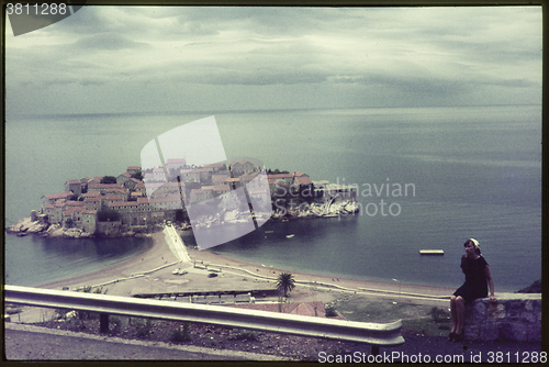 Image of Original vintage colour slide from 1960s, young woman relaxing o