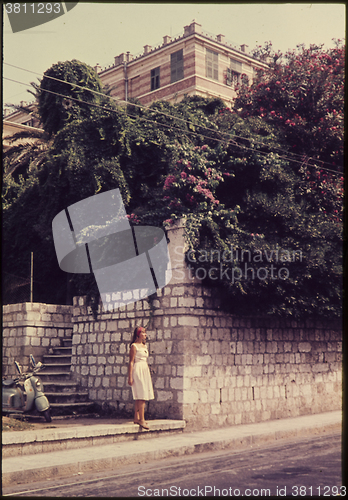 Image of Original vintage colour slide from 1960s, young woman standing i