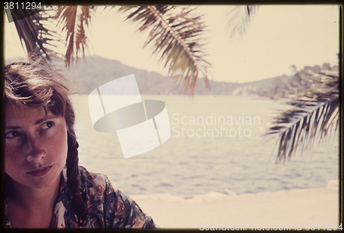 Image of Original vintage colour slide from 1960s, young woman sitting by