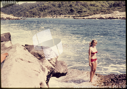 Image of Original vintage colour slide from 1960s, young woman standing b