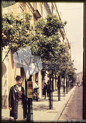 Image of Original vintage colour slide from 1960s, young woman poses in a