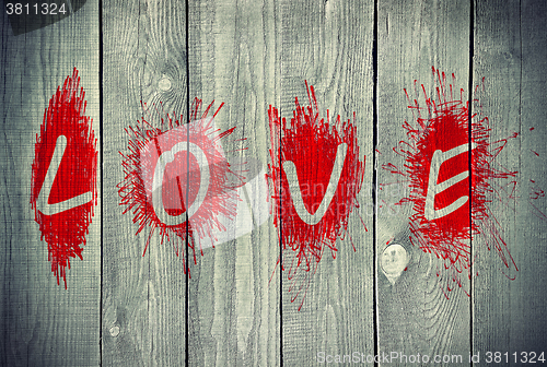Image of Word "Love" on a wooden wall 