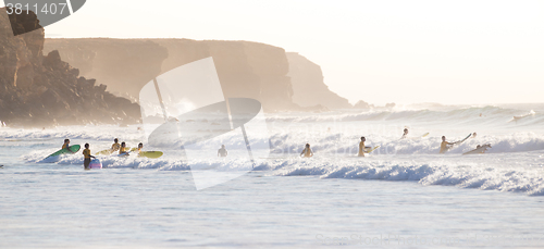 Image of Surfers surfing on El Cotillo beach, Fuerteventura, Canary Islands, Spain.