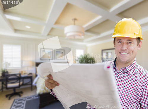 Image of Contractor in Hard Hat Over Custom Bedroom Drawing and Photo