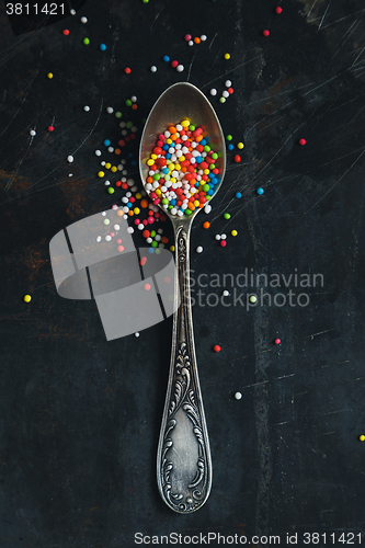 Image of Colorful Sugar Balls in vintage spoon