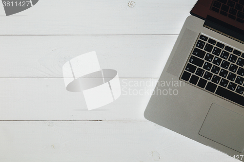 Image of Laptop on the white wooden desk