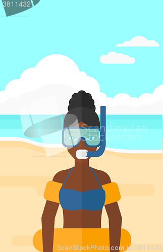 Image of Woman with swimming equipment.