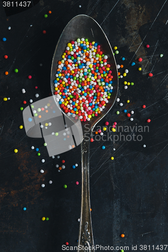 Image of Colorful Sugar Balls in vintage spoon