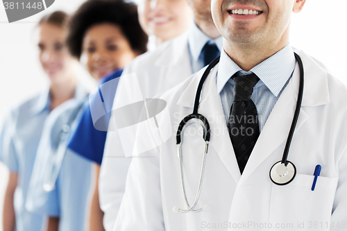 Image of close up of happy doctors with stethoscope