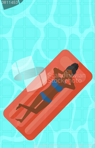 Image of Woman relaxing in swimming pool.