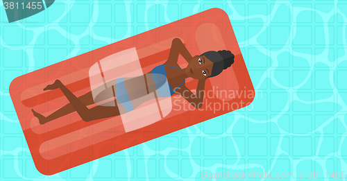 Image of Woman relaxing in swimming pool.