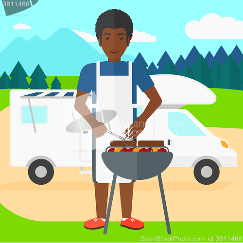 Image of Man preparing barbecue.