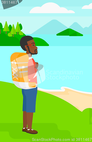 Image of Man with backpack hiking.