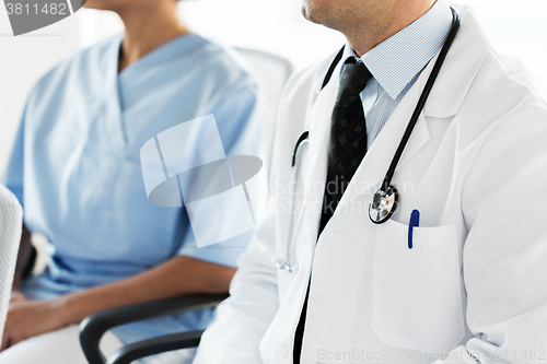 Image of close up of happy doctors at seminar or hospital