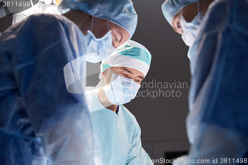 Image of group of surgeons in operating room at hospital