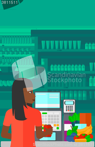 Image of Cashier at supermarket checkout.