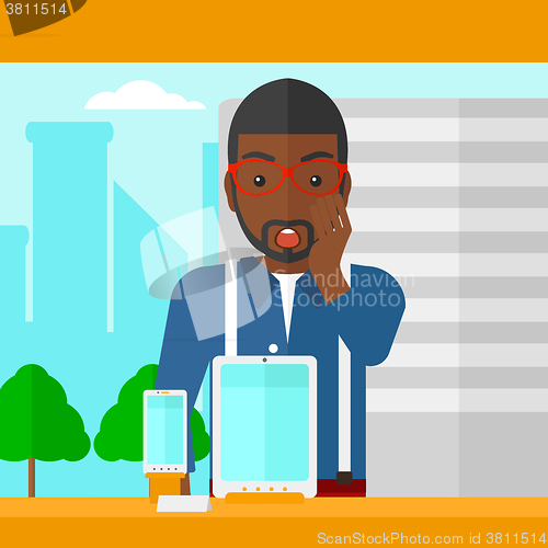 Image of Man looking at shop window.