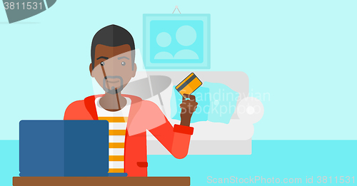 Image of Man making purchases online.