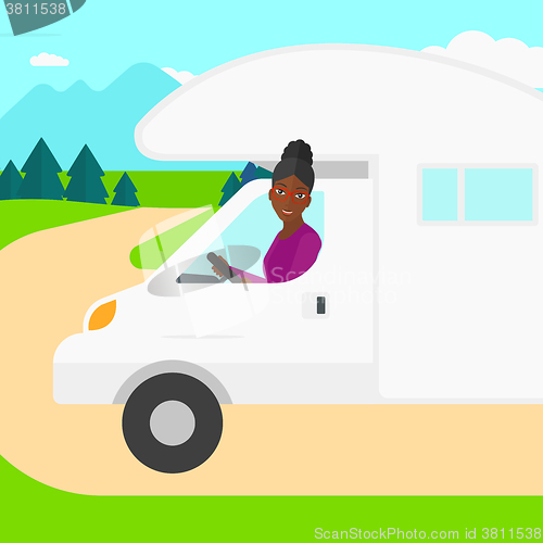 Image of Woman driving motor home.