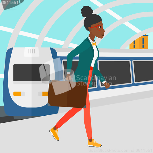 Image of Woman going out of train.