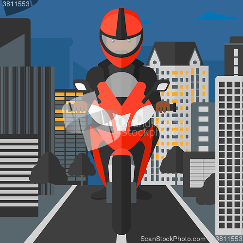 Image of Man riding motorcycle.