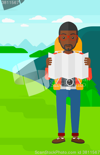 Image of Backpacker looking at map.