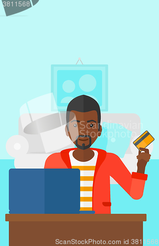 Image of Man making purchases online.