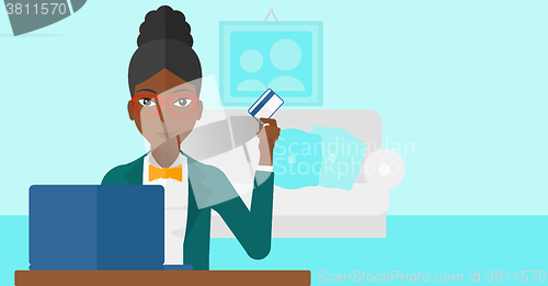 Image of Woman making purchases online.