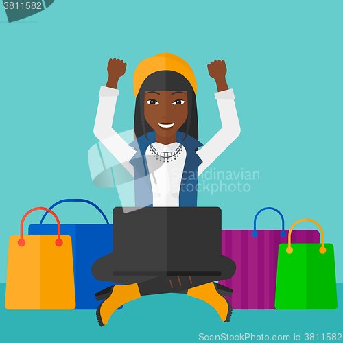 Image of Woman making purchases online.