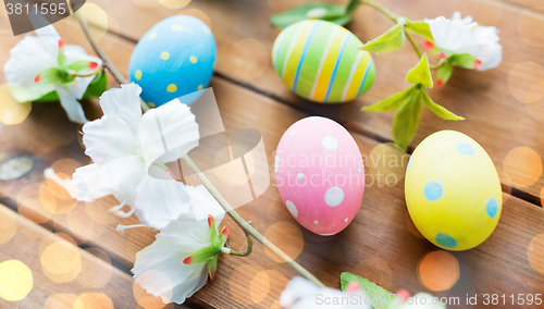 Image of close up of colored easter eggs and flowers