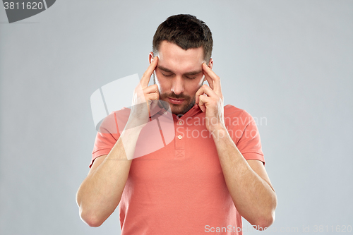 Image of man suffering from head ache or thinking