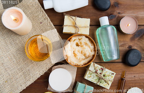 Image of close up of body care cosmetic products on wood