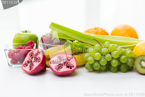 Image of close up of fresh fruits and berries on table