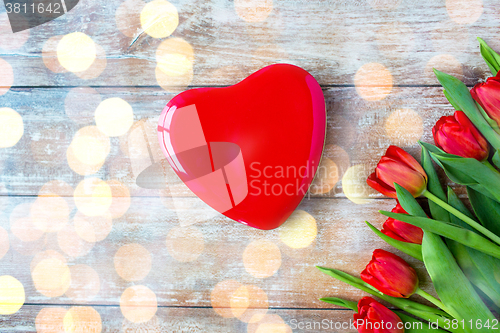 Image of close up of red tulips and chocolate box