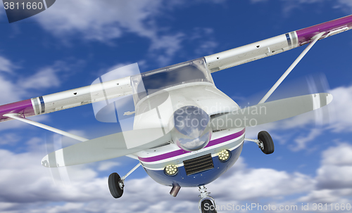 Image of Front of Cessna 172 Single Propeller Airplane In The Sky