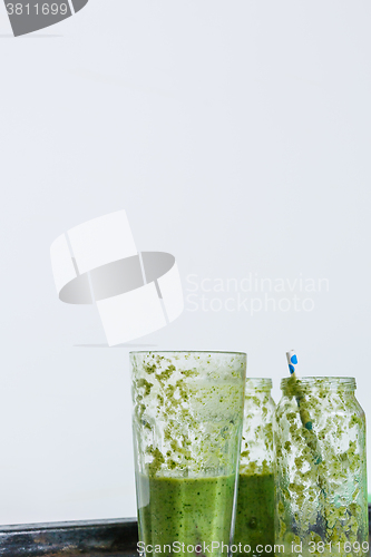 Image of empty glasses of green smoothie