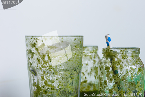 Image of empty glasses of green smoothie