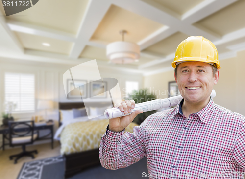 Image of Contractor in Hard Hat Over Custom Bedroom Drawing and Photo