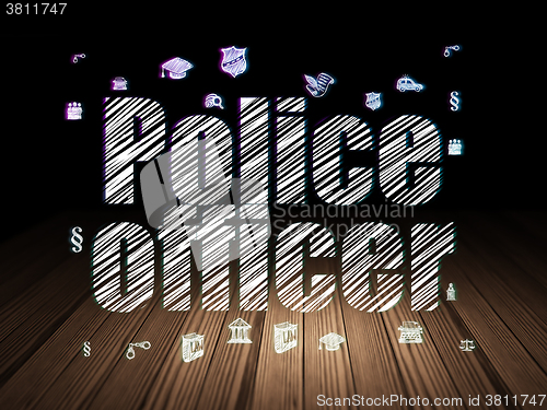Image of Law concept: Police Officer in grunge dark room