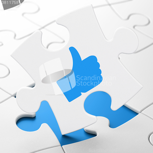 Image of Social network concept: Thumb Up on puzzle background