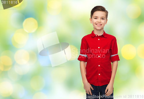 Image of happy boy in red shirt over green lights