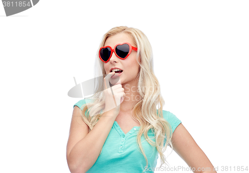 Image of happy young blonde woman or teenager in sunglasses