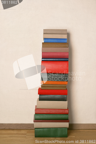 Image of Old books on wooden floor