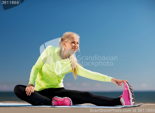 Image of woman doing sports outdoors