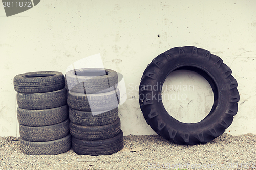 Image of close up of wheel tires stored near wall