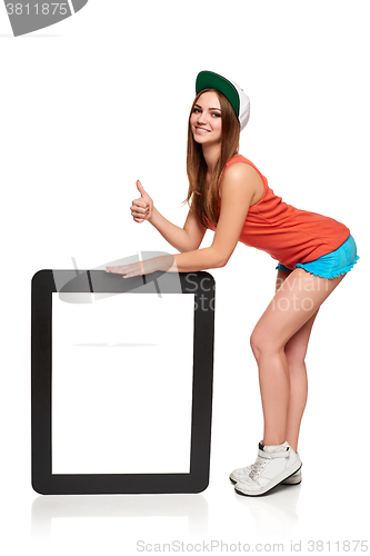 Image of Teen funky girl standing with a frame