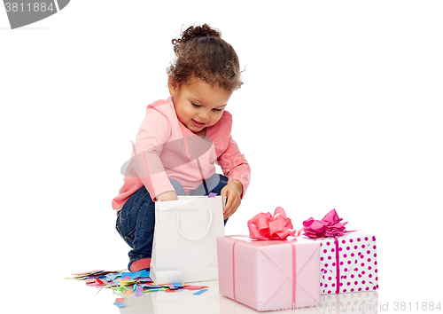 Image of happy little baby girl with birthday presents